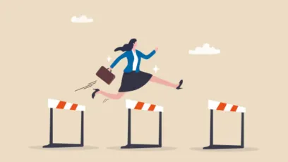 Woman running and jumping over hurdles