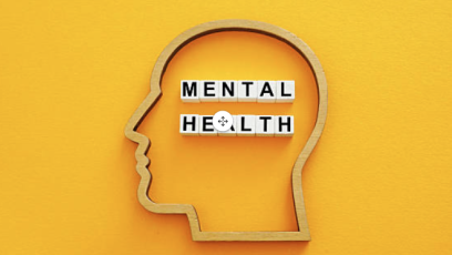 The outline of a head with the words MENTAL HEALTH spelled out in tiles