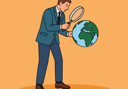 Man in a suit and tie holding up a magnifying glass while examining the Earth