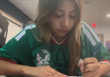 Allyson Hurtado Fernandez works on an assignment at her desk at Tempe High School as part of her day as a Dual Enrollment student.